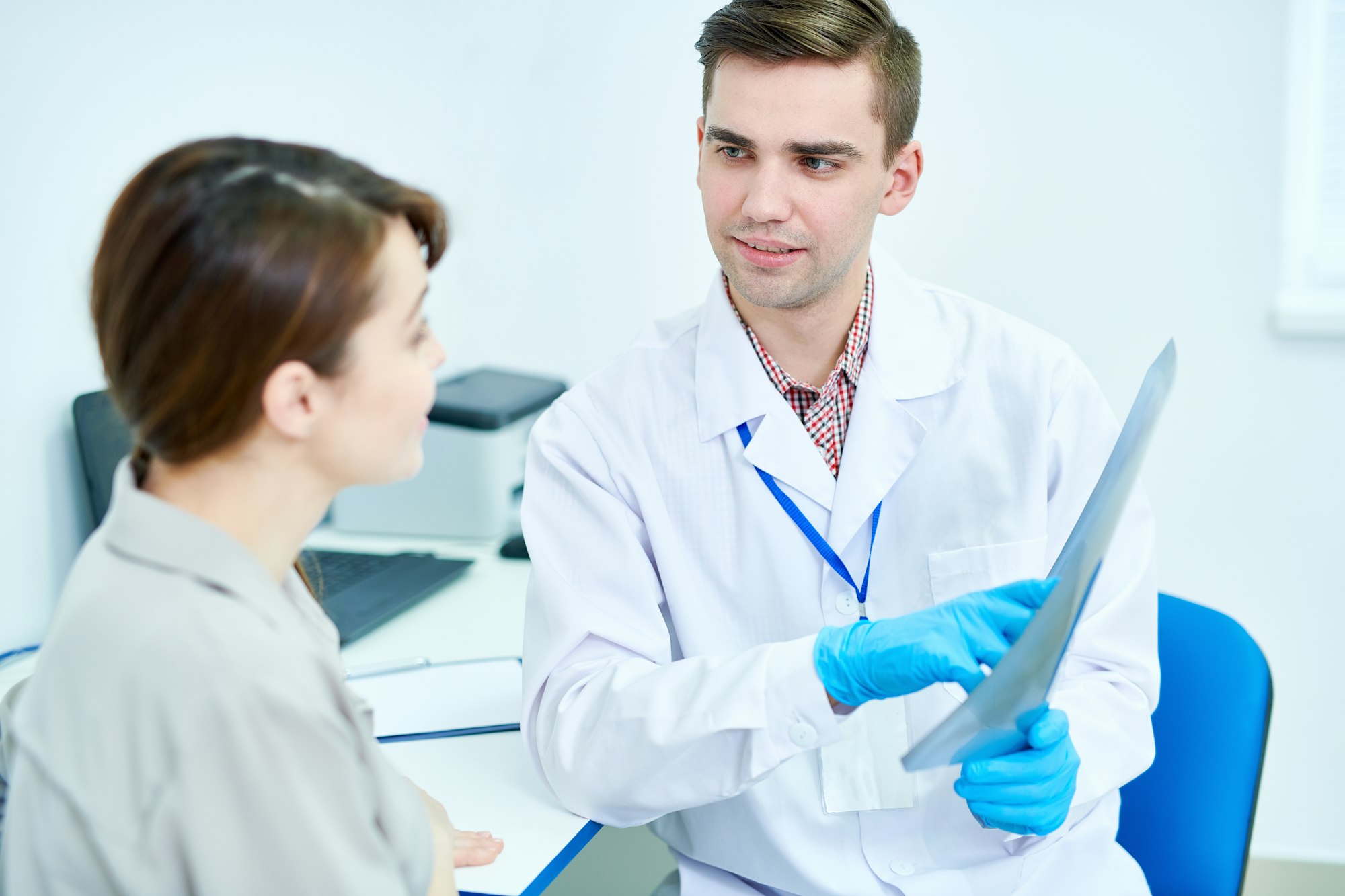 Doctor Holding X-Ray Image